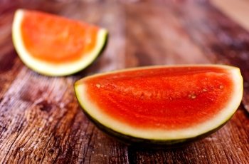 fresh organic watermelon slice over wooden boards