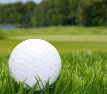 Golf Ball in Grass -  Golf Course in Background
