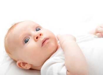 Baby Lying on Back on White Background