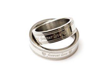 Wedding rings of Forever Love isolated on white background 
