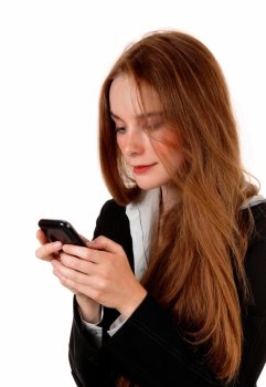 A young business woman texting on her cell phone, with long brunettehair, isolated for white background.