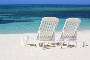 Sun loungers facing the Caribbean Sea
