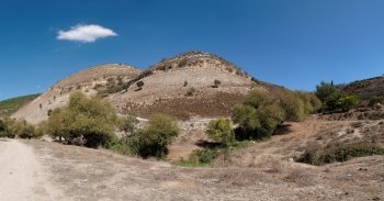 Twin round hills among Mediterranean landscape