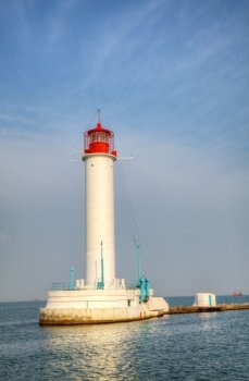 Lighthouse as seen from seaside at sunny day