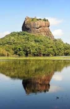 Sigiriya (Lion’s rock) is an ancient rock fortress and palace ruin of Sri Lanka, surrounded by the remains of an extensive network of gardens, reservoirs, and other structures. A popular tourist destination, Sigiriya is also renowned for its ancient paintings