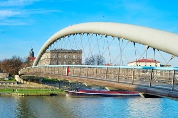 Side view of Father Bernatek Footbridge across the Wisla river. Krakow