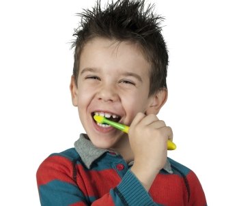 Boy brushing his teeth. White isolated
