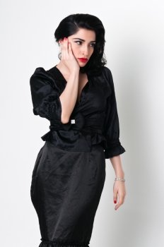 Young brunette in a vintage black dress