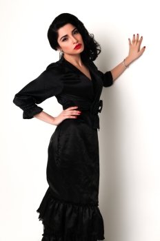 Young brunette in a vintage black dress