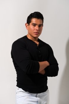 Athletic young man in a black shirt and jeans