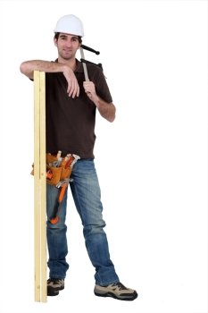 craftsman measuring a wooden board