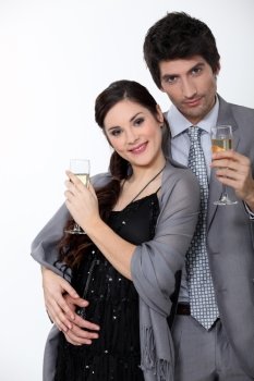 Glamorous couple drinking champagne