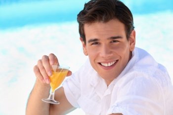 young man enjoying an orange juice
