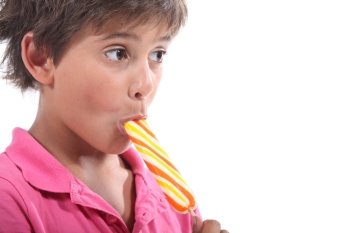 Boy eating lolly pop