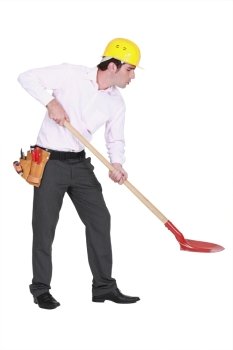Man with helmet and shovel