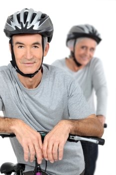 Elderly couple cycling