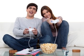 Young couple playing to video games