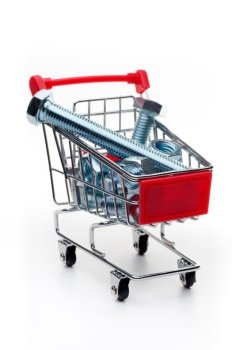Supermarket cart. Supermarket cart, loaded with assorted steel nuts and bolts, isolated on white background