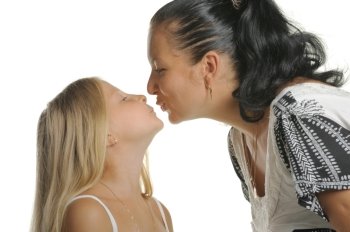 Mum kisses the daughter. It is isolated on a white background