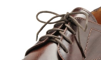 Man’s shoes from a brown leather. A photo close up