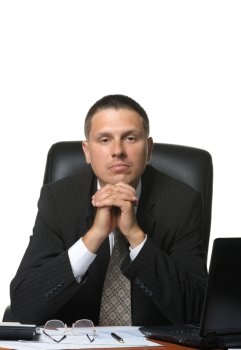 The businessman on the workplace. It is isolated on a white background