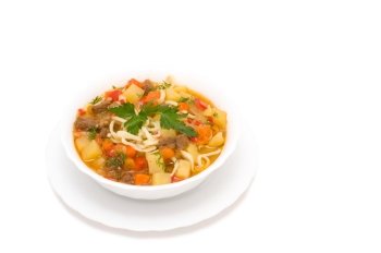 potato soup with pieces of meat, noodles and vegetables