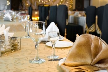 a served restaurant table, golden interior, shallow DOF