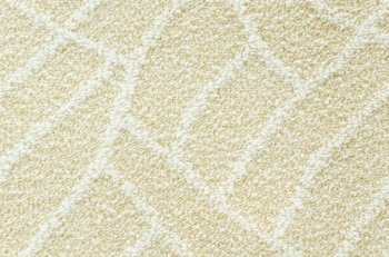 a woolen beige carpet with a relief pattern