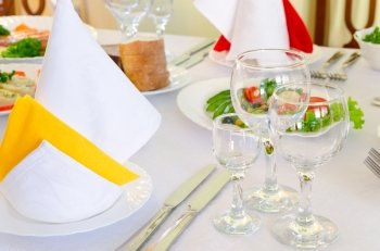 place setting at laid restaurant banquet table