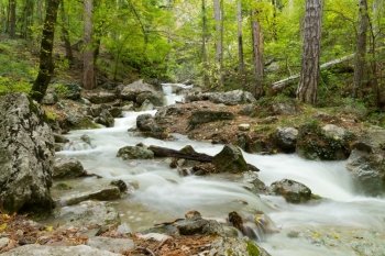 Stream of the mountain river ( long exposure ) in Crimea .