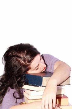 Young beautiful woman sleeping with books in a white background