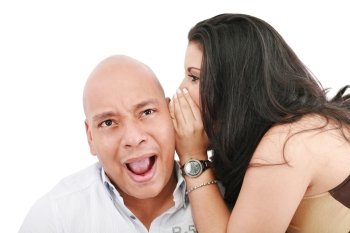 Closeup portrait of a cute young woman whispering in her husband ear 