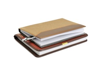 Notebook and pen isolated on a white background                                    