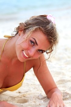 Young pretty woman in bikini at the beach