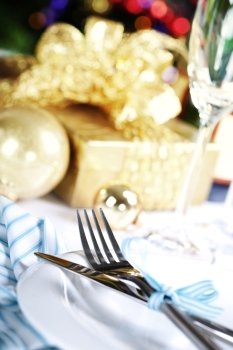place setting on Christmas tree background