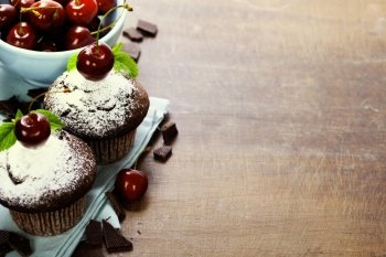 fresh chocolate muffins with cherry