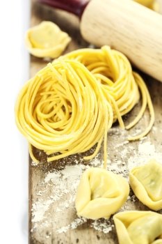 Making homemade pasta on wooden table