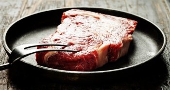 Marbled beef steak in a frying pan