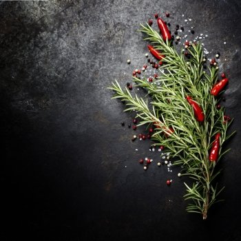 Bunch of spices on dark vintage background. Cooking, vegetarian food or health concept.