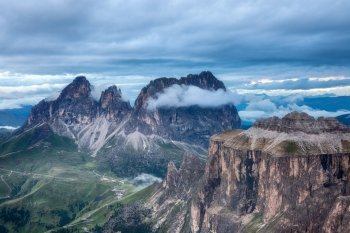 Cloudy and foggy sunrise at Dolomites mountains, Italy