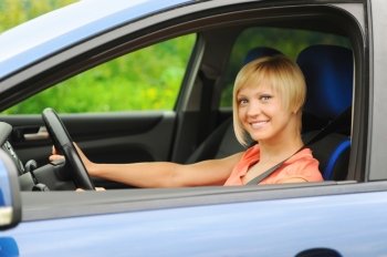 portrait  smiling young woman in the car