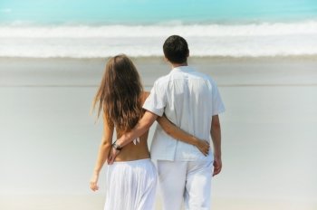 Young beautiful couple on a sunny beach