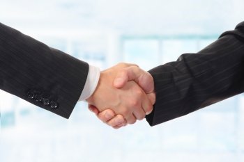 Businessman holds out his hand for a handshake. Isolated on white background