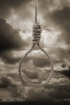 Sepia toned photograph of a hangman’s Noose against cloudy sky.