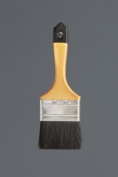 Yellow clean new paint brush on grey