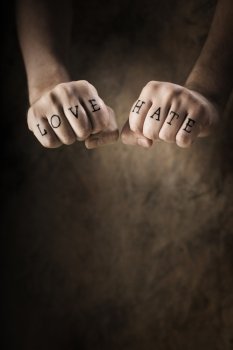 Man with Love and Hate (fake) tattoos.