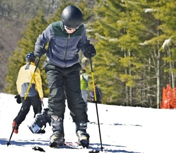 A young boy getting ready to ski.
