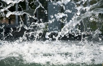 Splashes of water in city fountain