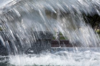 Stream of water in city fountain in motion