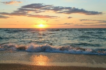 Sea  sunset surf great wave break on sandy coastline